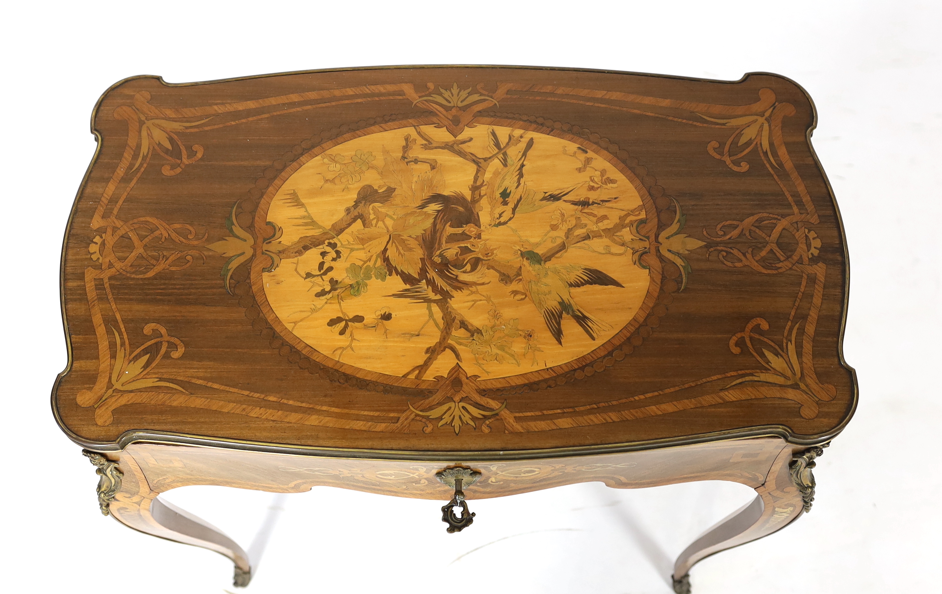 A Louis XV style marquetry side table, 66cm wide, 37cm deep, 68cm high, Please note this lot attracts an additional import tax of 5% on the hammer price